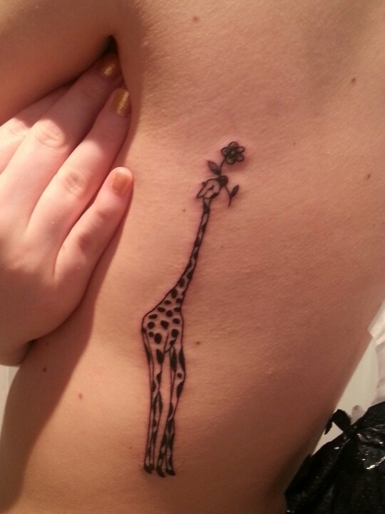 giraffe with flower tattoo