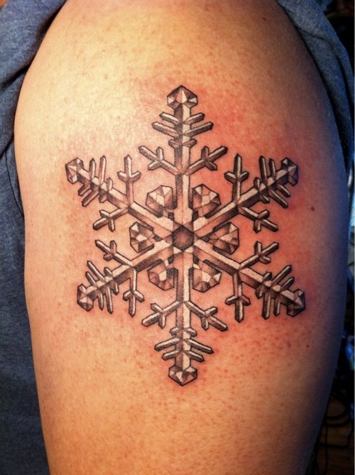 interesting snowflake tattoo on arm