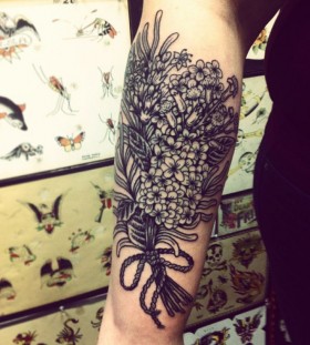 large black and white lilac tattoo on arm
