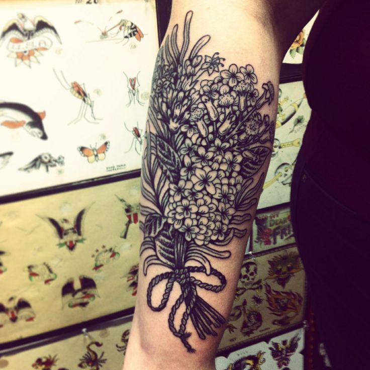 large black and white lilac tattoo on arm