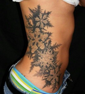 large black ans white snowflake tattoo
