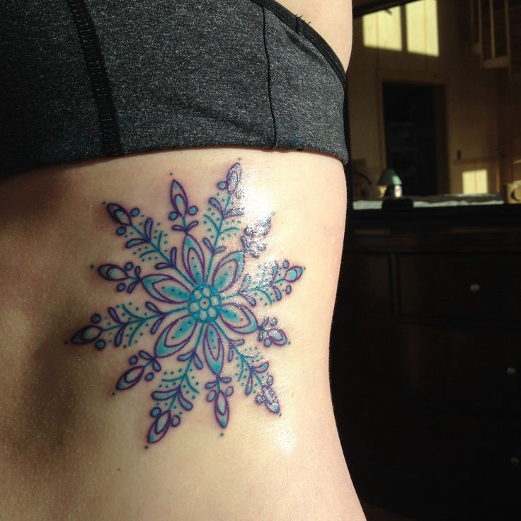 large blue snowflake tattoo