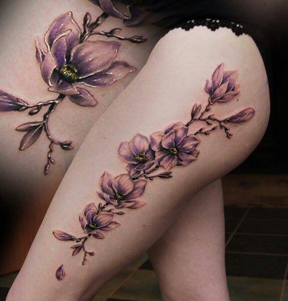 large lilac tattoo on thigh