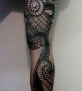 large snake tattoo on leg