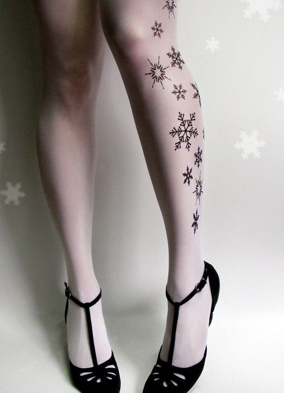large snowflake tattoo on leg