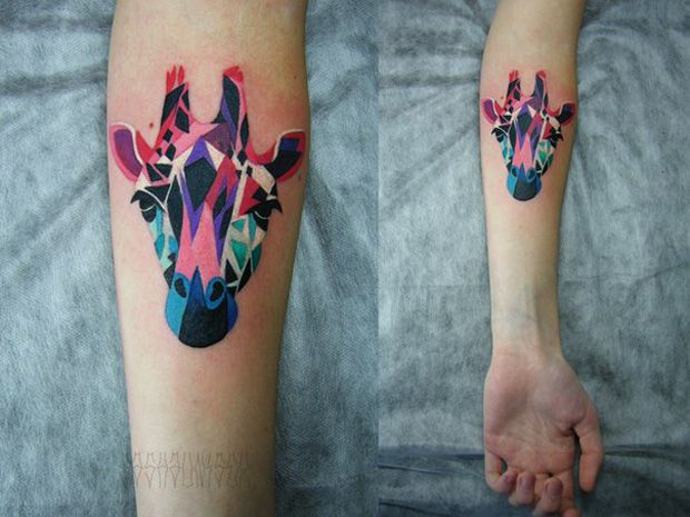 multicolor giraffe tattoo on arm