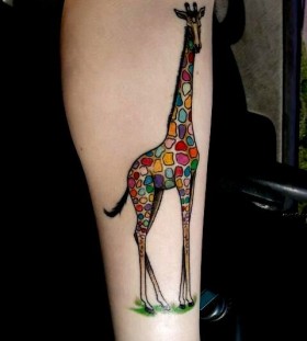 multicolor giraffe tattoo on leg