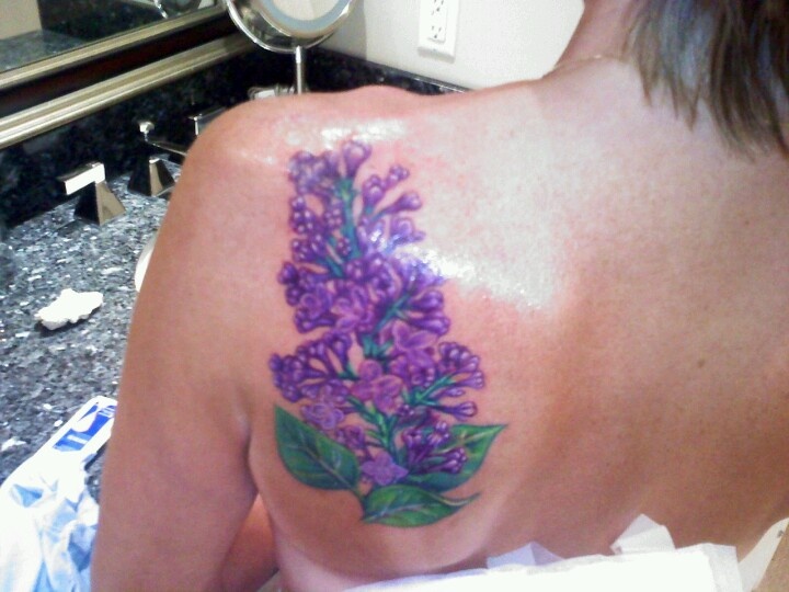 multicolored lilac tattoo on the back