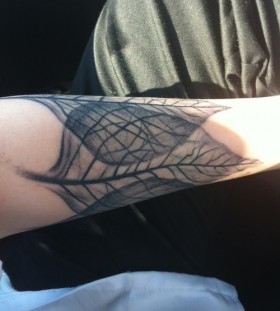 overlapping leaves tattoo