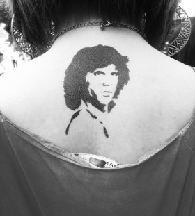 small jim morrison tattoo on the back