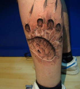 3D claw print on calf tattoo