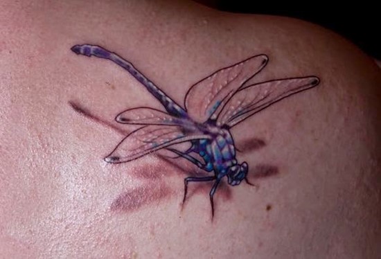 3D dragonfly on shoulder tattoo