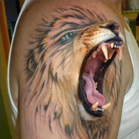 3D lion on arm tattoo