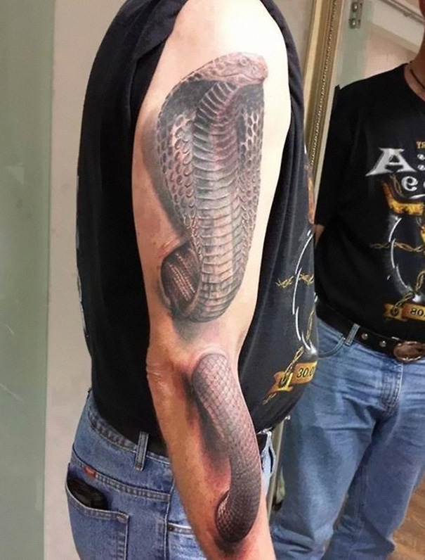 3D snake on arm tattoo