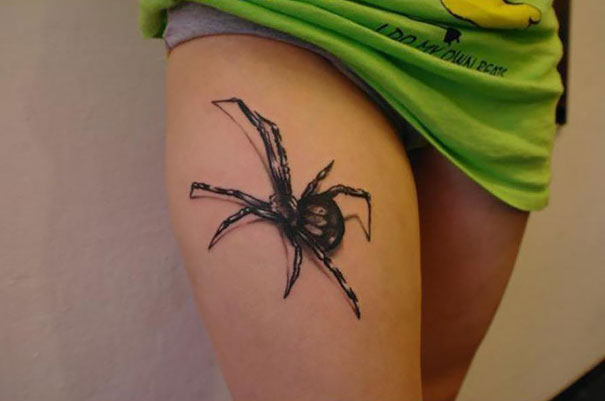 3D spider on thigh tattoo