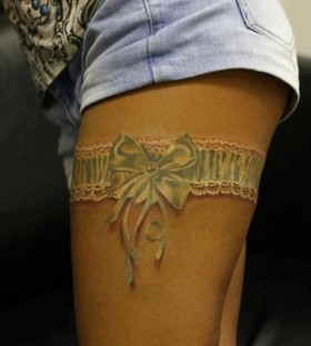3D white garter thigh tattoo