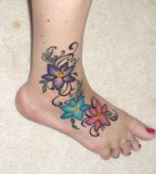 Wonderful Flower Tattoo Designs on Woman's Foot