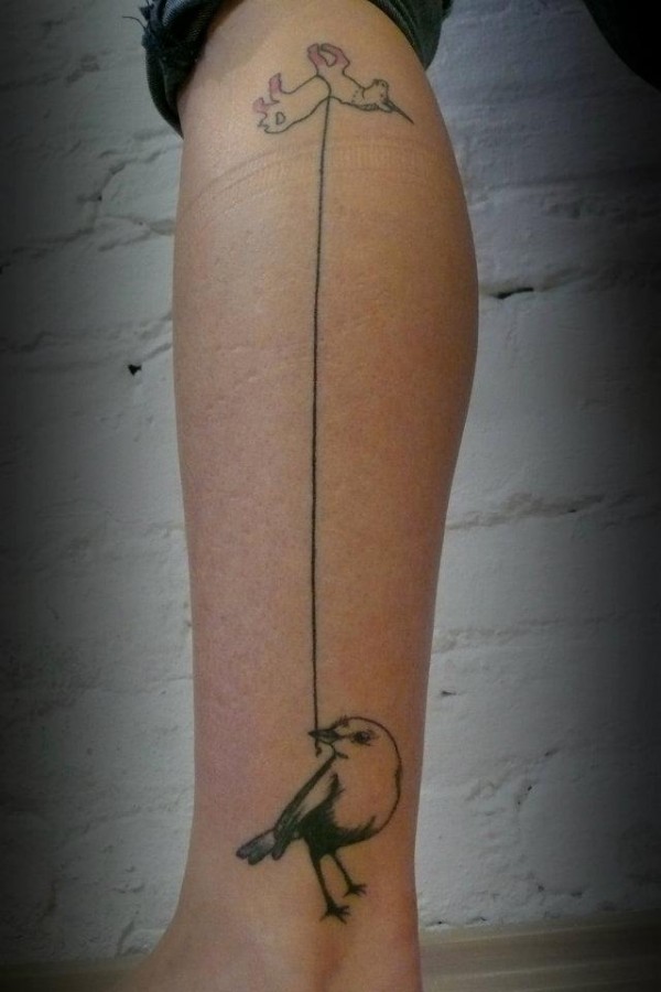 Adorable bird leg tattoo