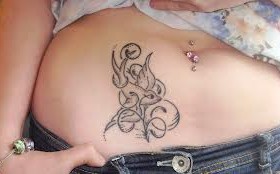Adorable bird stomach tattoo
