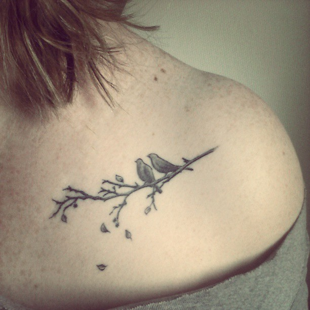 Adorable birds on a branch tattoo