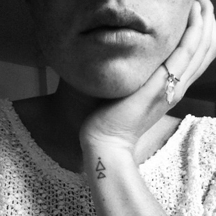 Adorable lips and triangle tattoo