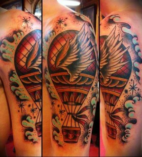 Air balloon with wings tattoo