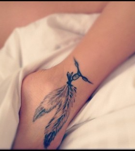 Amazing feathers ankle tattoo