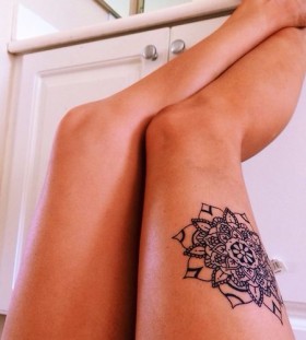 Amazing placement leg's mandala tattoo