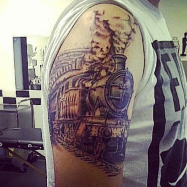 Amazing steaming train arm  tattoo