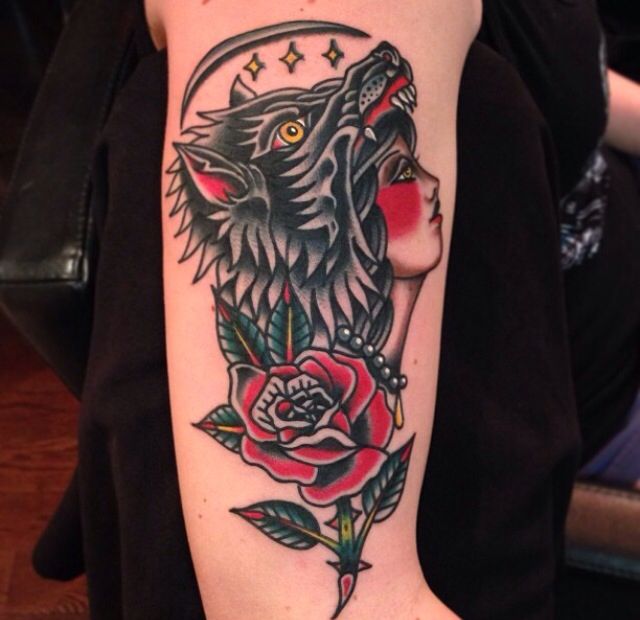 Amazing woman with wolf’s head tattoo by Nick Oaks