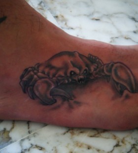 Angry crab foot tattoo