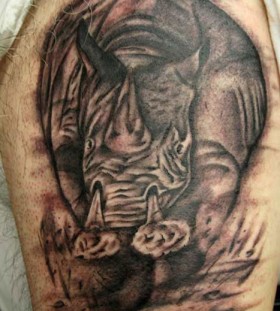 Angry rhino arm tattoo