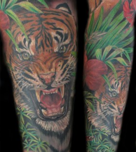 Angry tiger in jungle tattoo
