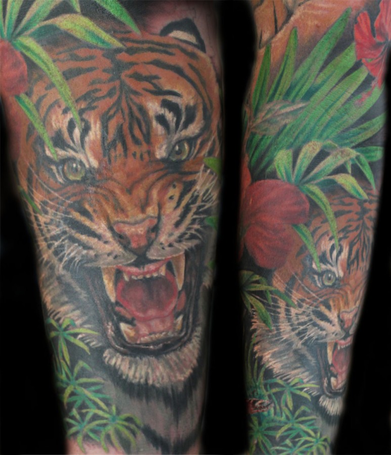 Angry tiger in jungle tattoo