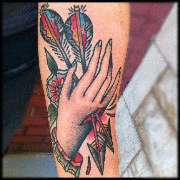 Arrows through hand tattoo by Nick Oaks