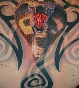 Atacking cobra back tattoo