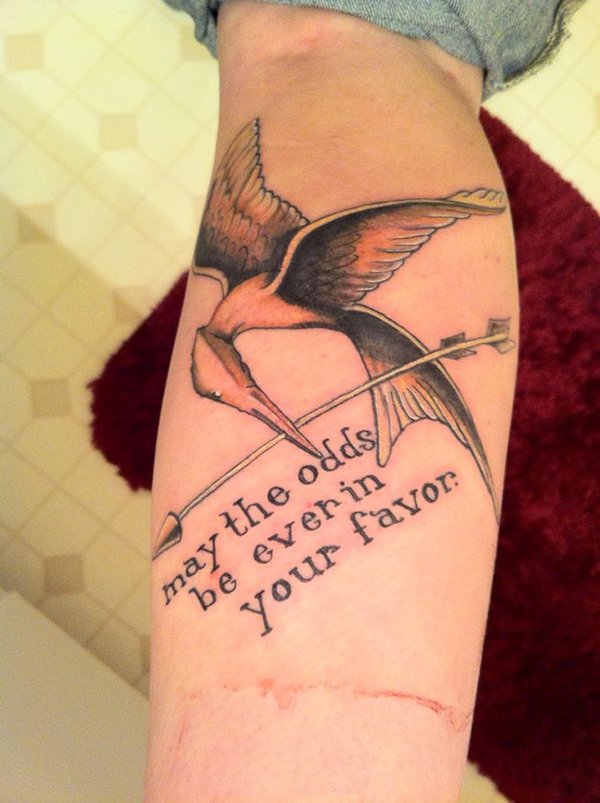 Awesome mockingjay with quote tattoo