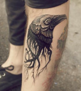 Awesome raven's head leg tattoo