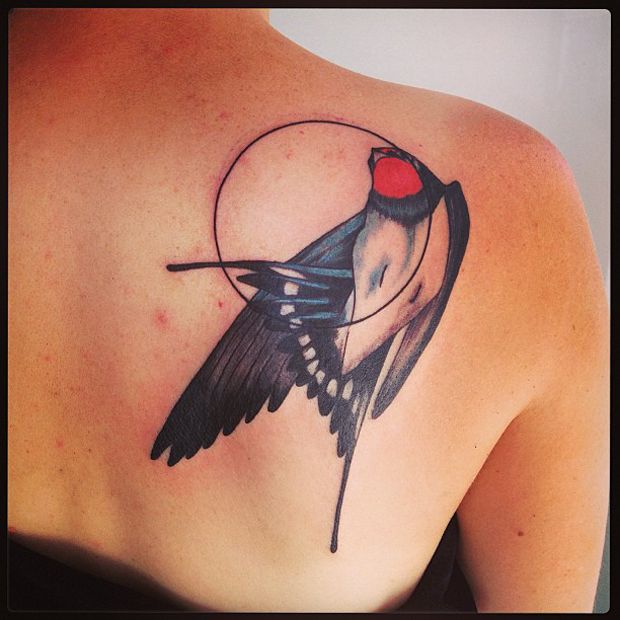 Beautiful bird back tattoo