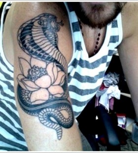 Beautiful cobra and flower tattoo