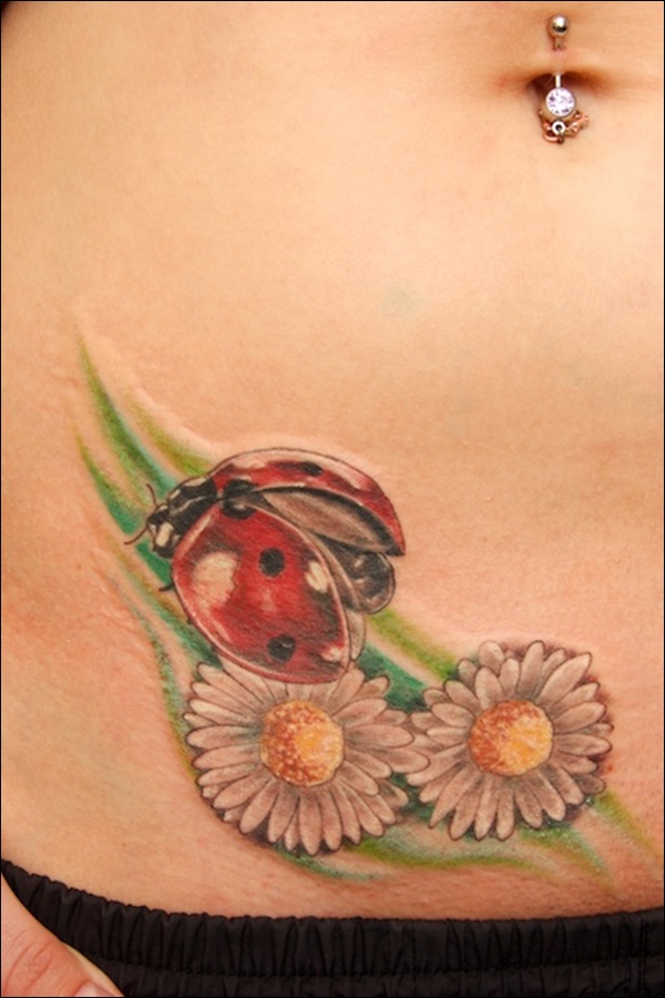 Beautiful ladybug and flower tattoo