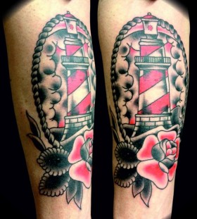 Beautiful lighthouse and rose tattoo