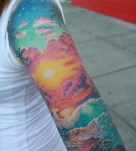 Beautiful sunset arm tattoo