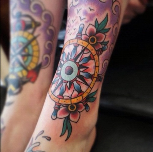 Beautiful wheel leg tattoo