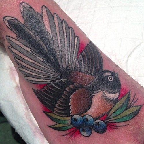 Bird and blueberries tattoo by Clare Hampshire