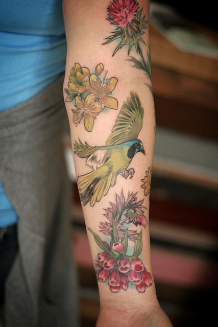 Bird and flowers tattoo