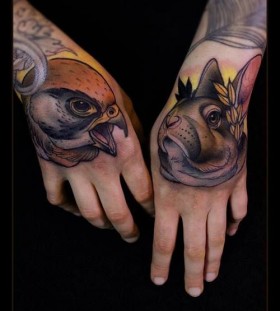 Bird and rabbit hand tattoos