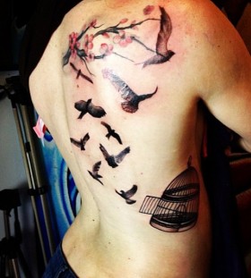 Birdcage and flying birds tattoo