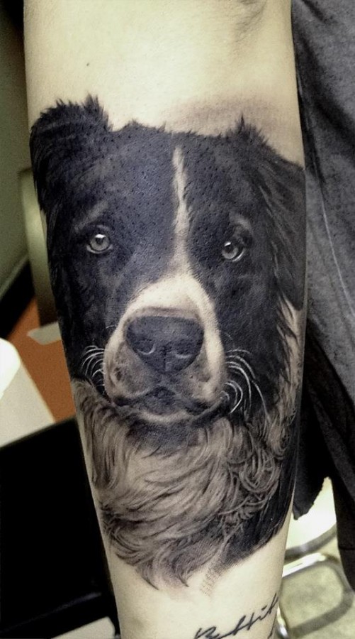 Black adorable dog’s tattoo