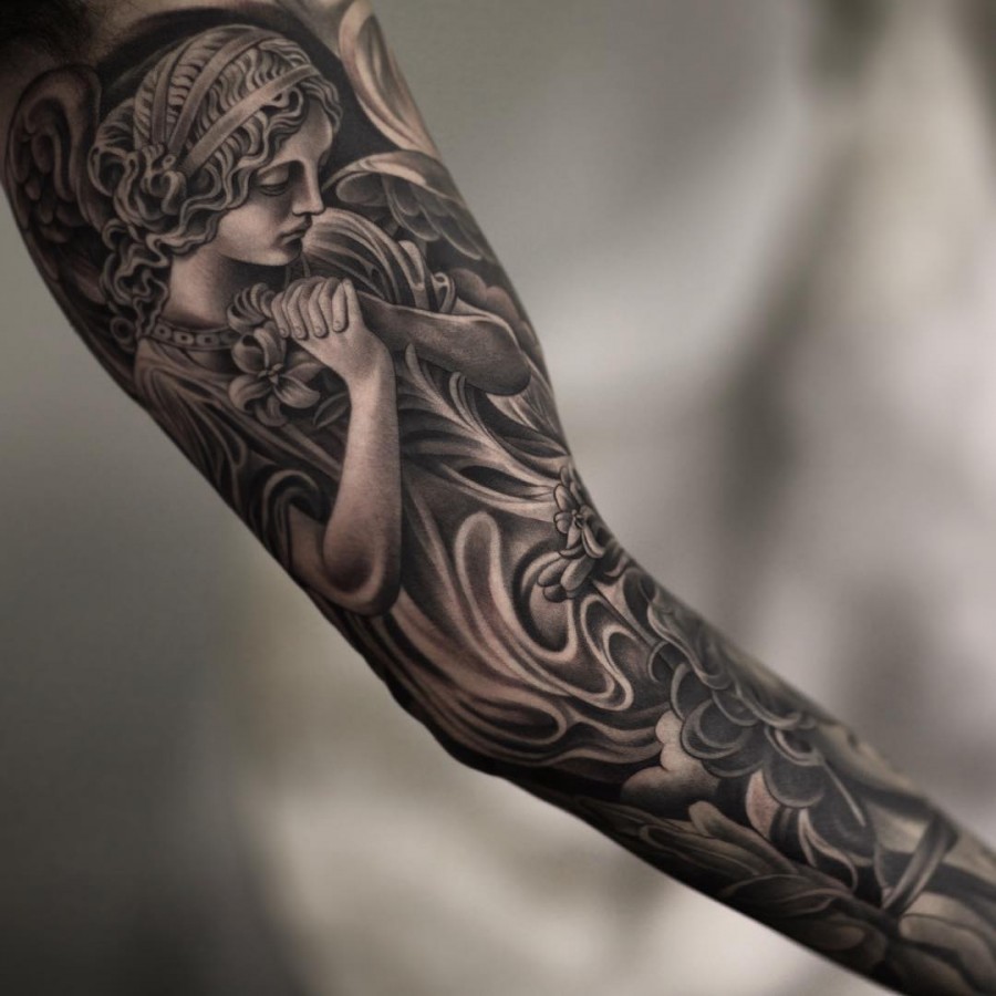 black and grey full sleeve tattoo by juncha